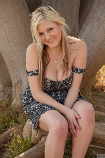 Curvy Blonde Flashes Her Big Tits Outdoors in a Skirt