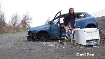 Tall Brunette in Boots Spreads Her Shaved Pussy in Public