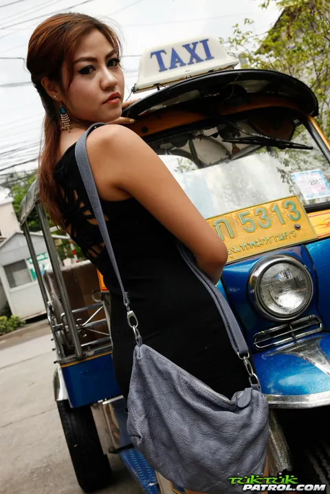 Thai Woman in a Dress and Glasses Poses for the Camera – photo 4 of 16
