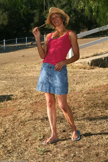 Skinny Short-Haired MILF Strips Out of Her Denim Skirt Outdoors