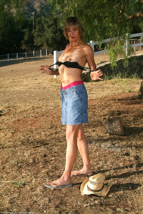 Skinny Short-Haired MILF Strips Out of Her Denim Skirt Outdoors – photo 9 of 21