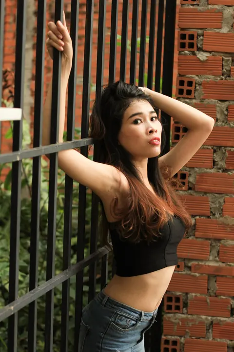 Petite Asian Brunette Poses in Jeans Outdoors – photo 4 of 21