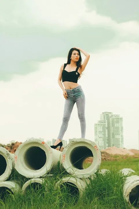 Petite Asian Brunette Poses in Jeans Outdoors – photo 19 of 21
