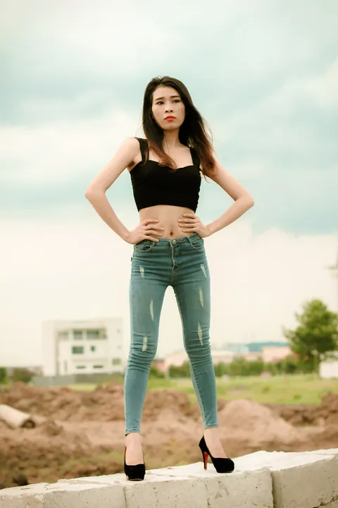 Petite Asian Brunette Poses in Jeans Outdoors – photo 8 of 21