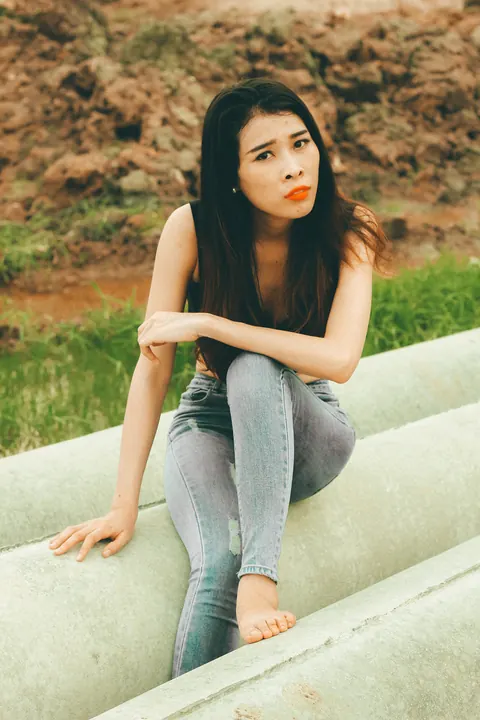 Petite Asian Brunette Poses in Jeans Outdoors – photo 18 of 21