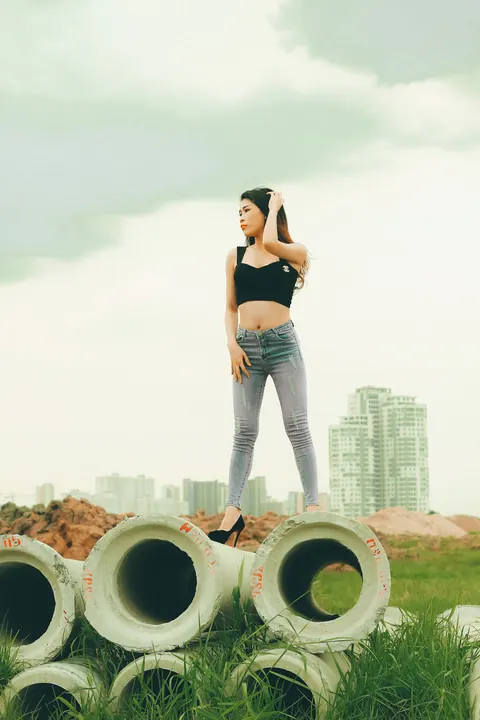 Petite Asian Brunette Poses in Jeans Outdoors – photo 20 of 21