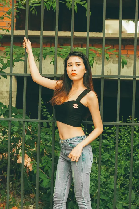 Petite Asian Brunette Poses in Jeans Outdoors – photo 7 of 21