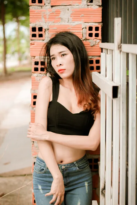 Petite Asian Brunette Poses in Jeans Outdoors – photo 2 of 21