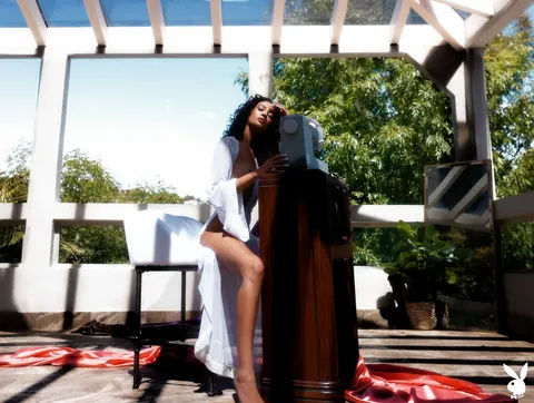 Curly Woman Undresses and Poses Nude Outdoors – photo 3 of 21