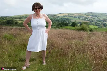 BBW MILF Doctor Strips Out of Her Bikini on a Blanket in the Forest