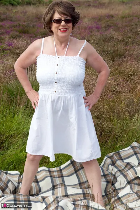 BBW MILF Doctor Strips Out of Her Bikini on a Blanket in the Forest – photo 3 of 16