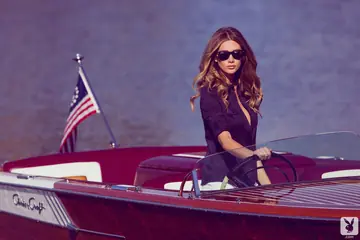 Tall Brunette in Glasses Spreads on a Boat
