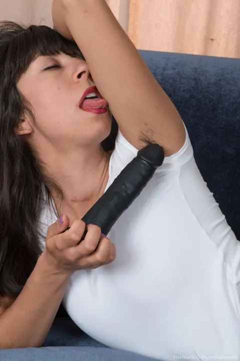 Vivi Marie: Brunette Latina Plays with a Dildo and Spreads Her Hairy Pussy on the Sofa – photo 4 of 17
