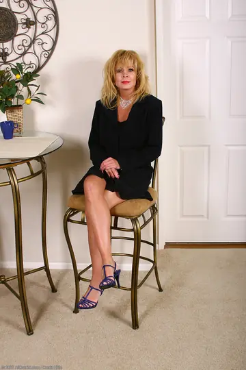 Busty Blonde MILF Strips Nude and Poses to Show Her Body