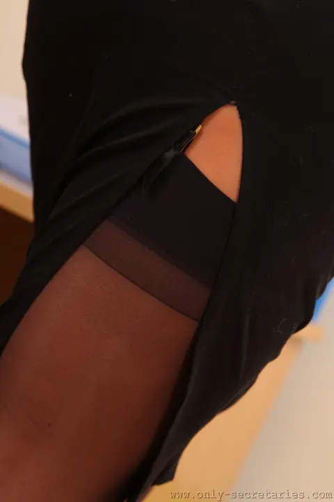 Busty Brunette in a Secretary Uniform Poses at the Office – photo 2 of 21