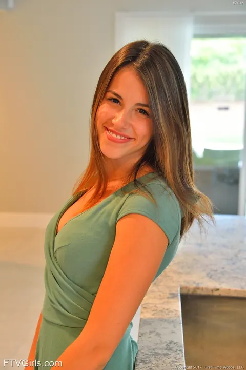 Slim Brunette in a Dress Poses in the Kitchen – photo 17 of 20