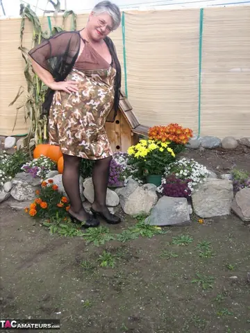 Thick Woman Reveals Her Big Tits from Girdle in the Garden