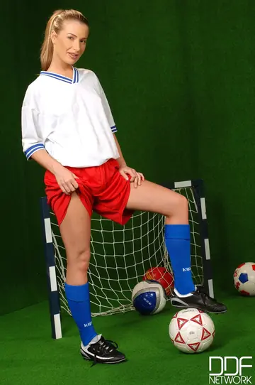 Hungarian Lesbians in Soccer Uniforms Use a Dildo Outdoors