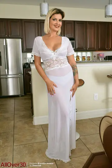 Tattooed Blonde MILF Bares Her Big Tanned Tits in the Kitchen