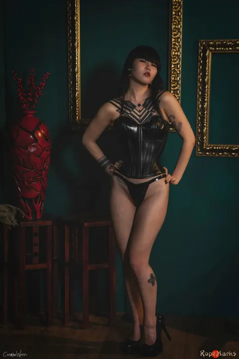 Thick Asian Brunette Flaunts Her Curves in a Leather Corset and Boots – photo 11 of 16