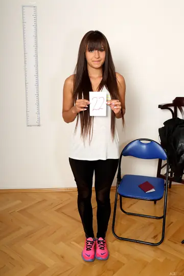 Tanned Brunette Undresses and Spreads Her Shaved Pussy