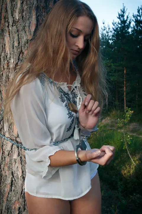 Blonde Lesbian in Bondage Plays with Hairy Pussy in the Forest – photo 1 of 21