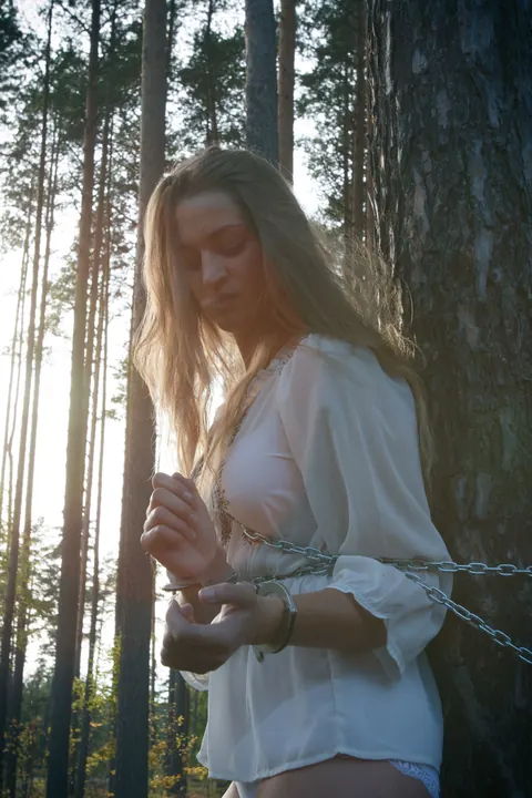 Blonde Lesbian in Bondage Plays with Hairy Pussy in the Forest – photo 2 of 21