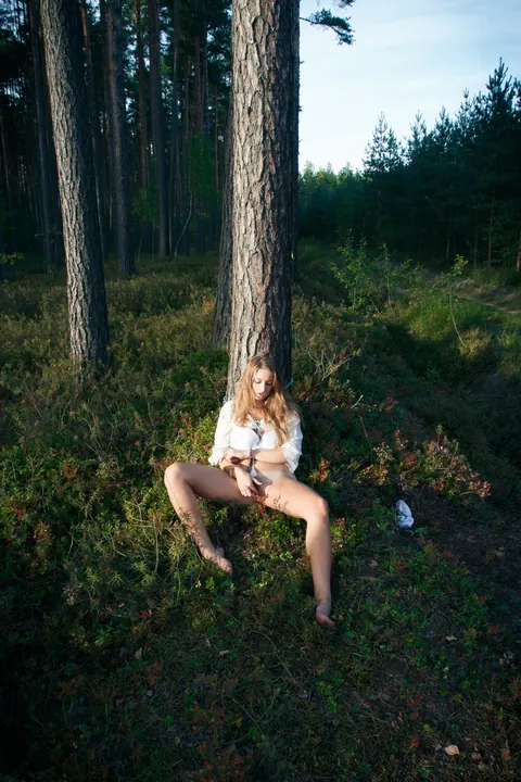 Blonde Lesbian in Bondage Plays with Hairy Pussy in the Forest – photo 16 of 21