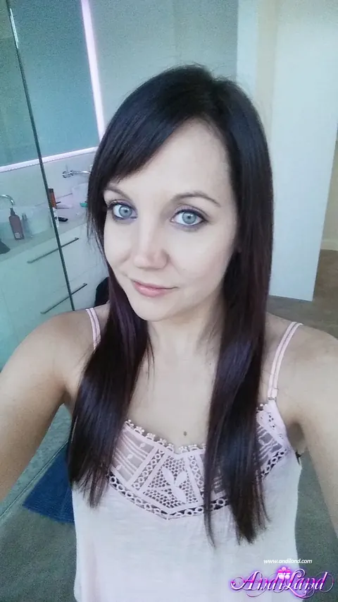 Andi Land: Brunette in Lingerie and Heels Oils Her Tits for Selfies – photo 11 of 15