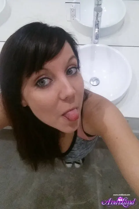 Andi Land: Brunette in Lingerie and Heels Oils Her Tits for Selfies – photo 8 of 15