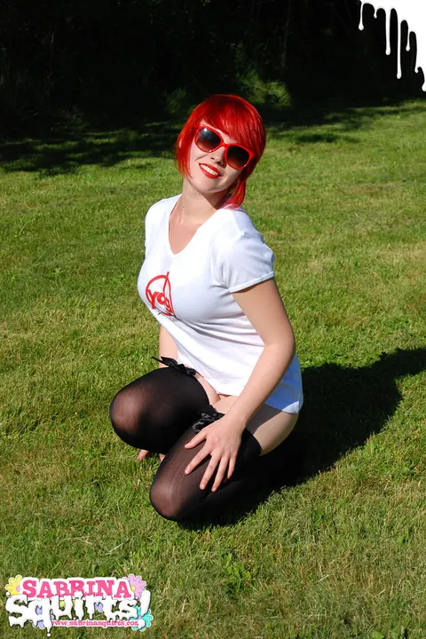 Sabrina Squirts: Redhead in Stockings and Glasses Strips Nude Outdoors – photo 4 of 12