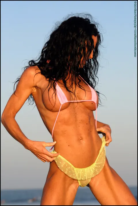 Brunette with Big Tits Poses in a Bikini on the Beach – photo 6 of 15