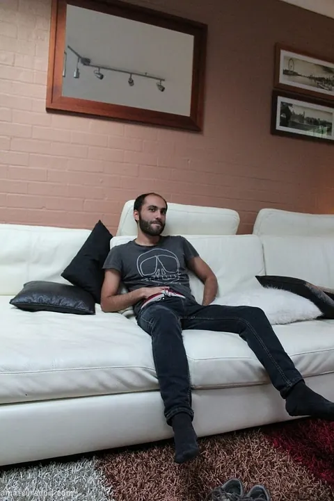 Hairy Ebony Man Strips and Masturbates on the Sofa – photo 8 of 21