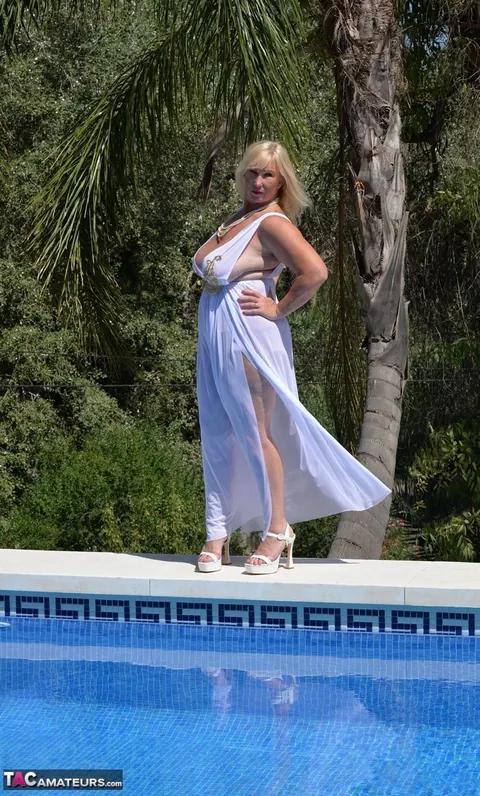 Blonde BBW in a White Dress and Heels Poses by the Pool – photo 2 of 16