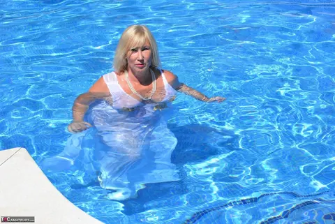Blonde BBW in a White Dress and Heels Poses by the Pool – photo 14 of 16