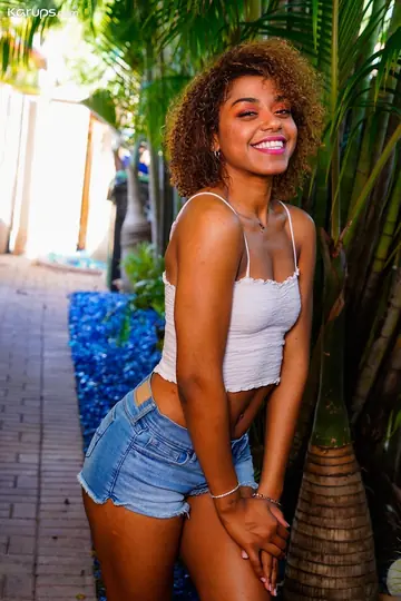 Curly Latina Strips Out of Her Shorts and Rubs Her Pussy Outdoors
