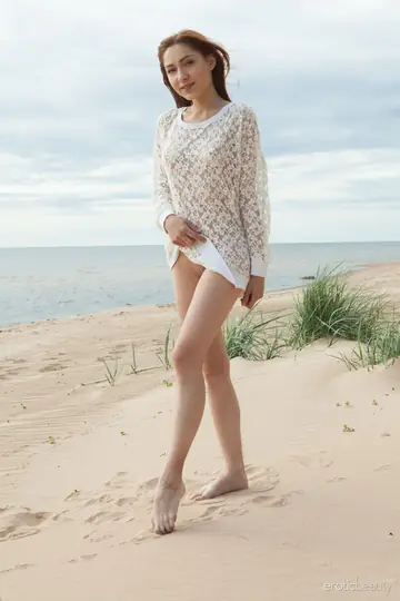Brunette Strips Nude and Spreads on the Beach