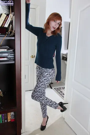 Redhead Pulls Her Panties Aside and Spreads Her Shaved Slit