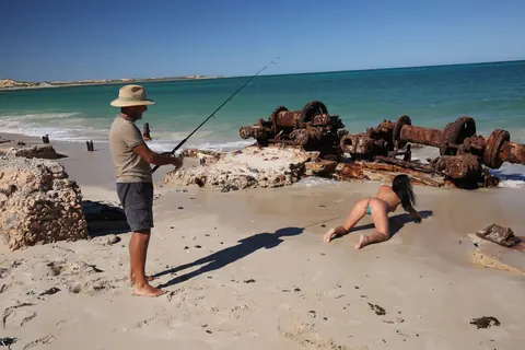 Brunette MILF with Big Tits Shows Off Her Bikini at the Beach – photo 7 of 18