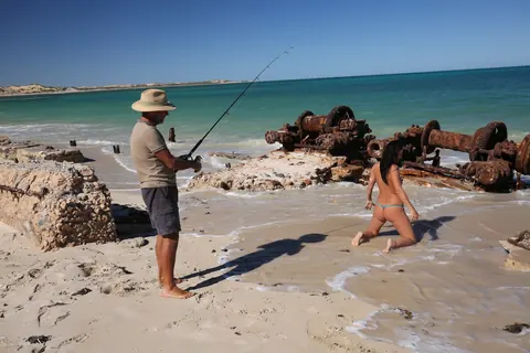 Brunette MILF with Big Tits Shows Off Her Bikini at the Beach – photo 6 of 18