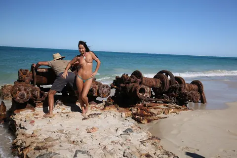 Brunette MILF with Big Tits Shows Off Her Bikini at the Beach – photo 13 of 18