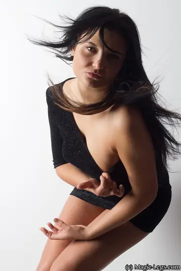 European PAWG Brunette Poses in a Skirt, Panties, and Heels