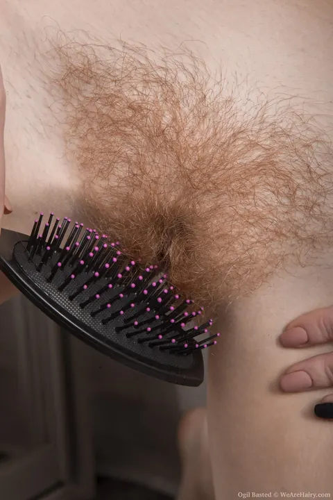 Ogil Basted: Pale Redhead Undresses and Spreads Her Hairy Bush – photo 11 of 18
