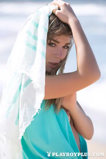 Woman Undresses on the Beach for a Centerfold