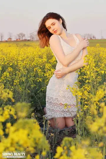 Woman Strips Out of Her Skirt and Poses Nude