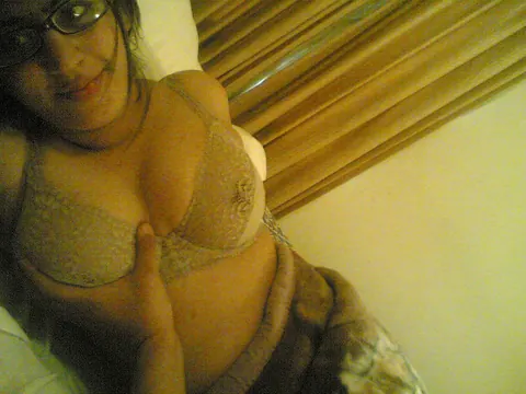 Curvy Indian Woman with Big Tits and Glasses Strips and Poses Nude – photo 7 of 10