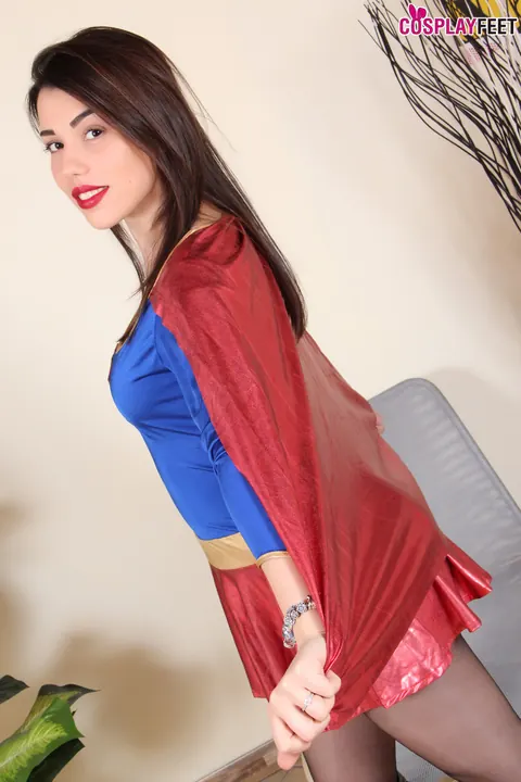 Brunette in Superman Costume Shows Her Pantyhose Feet – photo 2 of 10