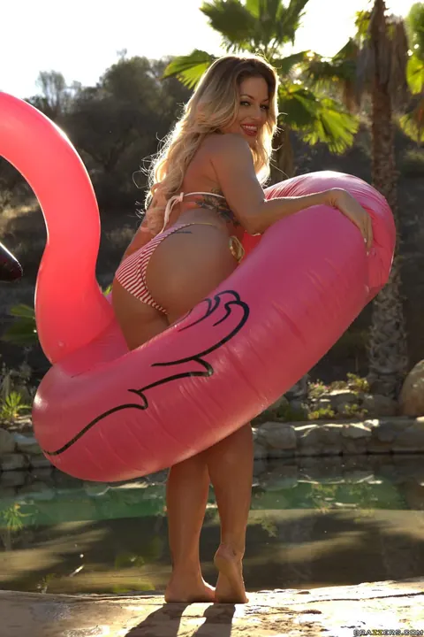 Kissa Sins: Tattooed Blonde Strips Off Her Bikini on Inflatable Swan Outdoors – photo 5 of 20