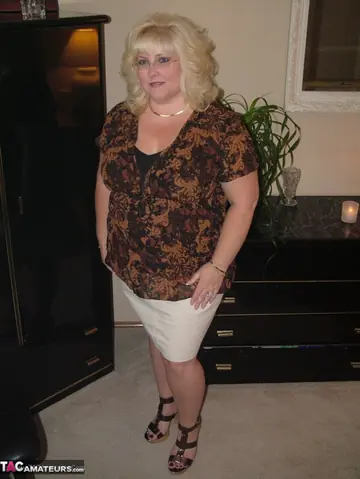 Curvy Blonde MILF Cups Her Big Tits in Lingerie and Glasses