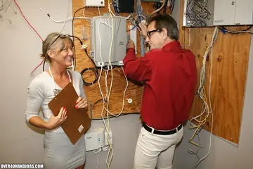 Tattooed Brunette MILF in Glasses Jerks Her Partner Off Until He Cums